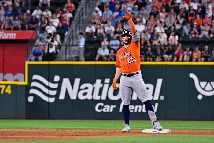 Jul 3, 2023; Arlington, Texas, USA; Houston Astros center fielder Chas McCormick (20) celebrates from second base after hitting a double and driving in the go ahead run against the Texas Rangers during the ninth inning at Globe Life Field. Mandatory Credit: Jerome Miron-USA TODAY Sports